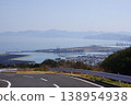 A view of Iho-Shinshima and Sumoto from the road leading to Tsuna-no-Sato in Awaji City, Hyogo Prefecture. 138954938