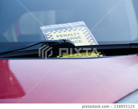 Parking ticket on windshield of car Parking ticket on windshield of car 138955125