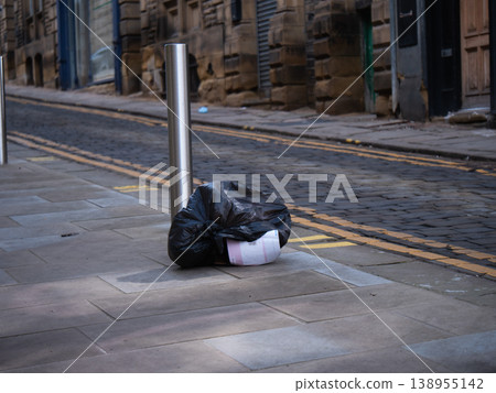 Bag of rubbish left on street 138955142