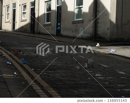 Rubbish blowing in the street Rubbish blowing in the street 138955143