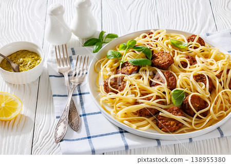 Pasta linguine with meatballs, pesto sauce, lemon Pasta linguine with meatballs, pesto sauce, lemon 138955380