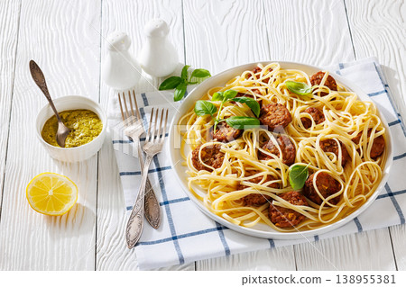 Pasta linguine with meatballs, pesto sauce, lemon 138955381
