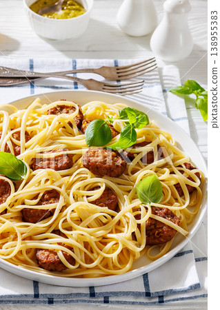 Pasta linguine with meatballs, pesto sauce, lemon 138955383