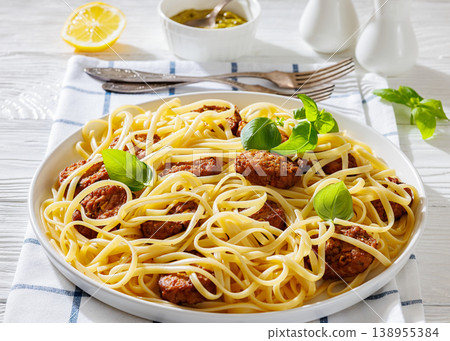 Pasta linguine with meatballs, pesto sauce, lemon Pasta linguine with meatballs, pesto sauce, lemon 138955384