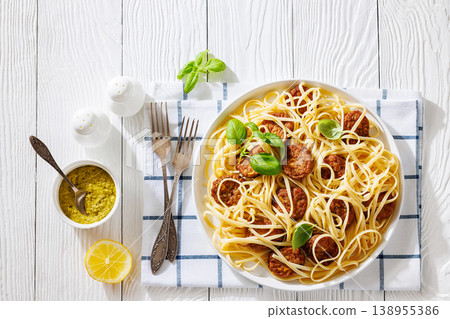Pasta linguine with meatballs, pesto sauce, lemon Pasta linguine with meatballs, pesto sauce, lemon 138955386