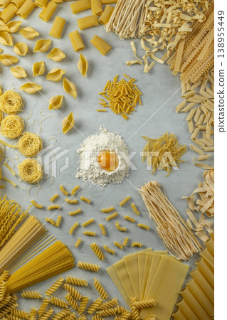 Assorted dry pasta types with flour and egg yolk Assorted dry pasta types with flour and egg yolk 138955449