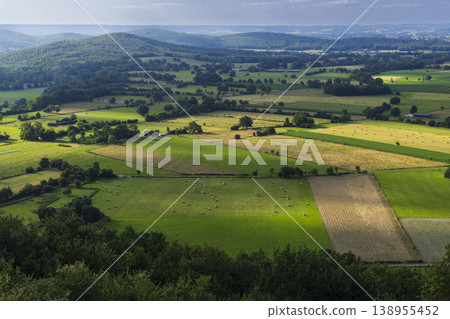 Rural French landscape with rolling hills and agricultural fields Rural French landscape with rolling hills and agricultural fields 138955452
