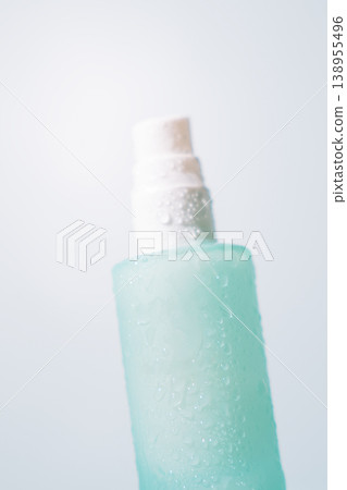 Close up of frosted cosmetic pump bottle in soft natural light Close up of frosted cosmetic pump bottle in soft natural light 138955496