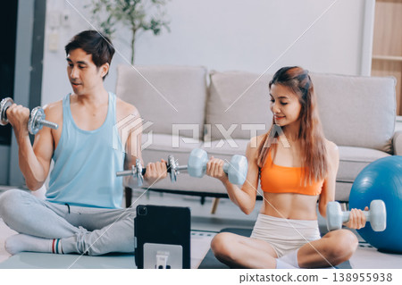 Support, teamwork and fitness couple doing workout training, challenging exercise for endurance, strength and stamina in a gym. Active, fit man and woman giving support and motivation during pushup 138955938
