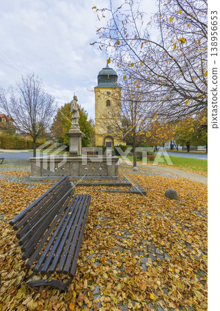 Primda square with historic tower and autumn leaves Primda square with historic tower and autumn leaves 138956653