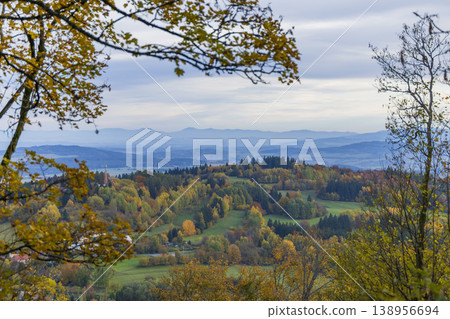 Autumn tree branches framing colorful valley landscape in Primda Autumn tree branches framing colorful valley landscape in Primda 138956694