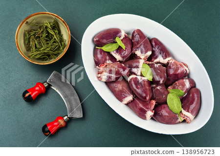 Raw turkey hearts with onion and herbs in baking dish Raw turkey hearts with onion and herbs in baking dish 138956723