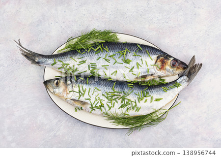 Fresh salted herring with herbs on plate Fresh salted herring with herbs on plate 138956744