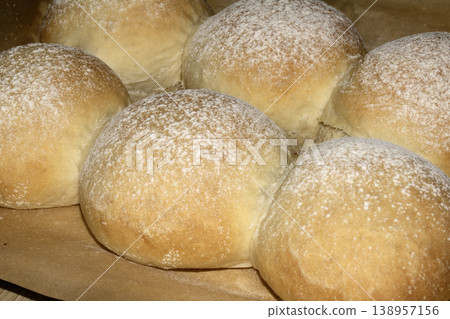 Delicious fresh baked bread rolls close up home made baked goods Delicious fresh baked bread rolls close up home made baked goods 138957156