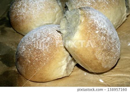 Delicious fresh baked bread rolls close up home made baked goods Delicious fresh baked bread rolls close up home made baked goods 138957160