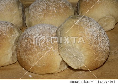 Delicious fresh baked bread rolls close up home made baked goods Delicious fresh baked bread rolls close up home made baked goods 138957161