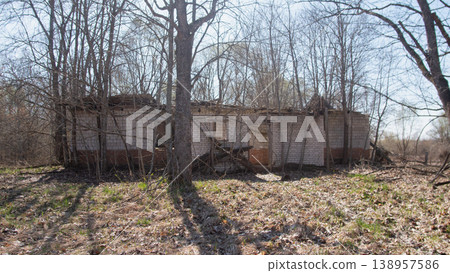 Long Wooden Barracks Under Bare Trees, Weathered Planks, Boarded Doors, Deep Shadows, Corrugated Metal Long Wooden Barracks Under Bare Trees, Weathered Planks, Boarded Doors, Deep Shadows, Corrugated Metal 138957586