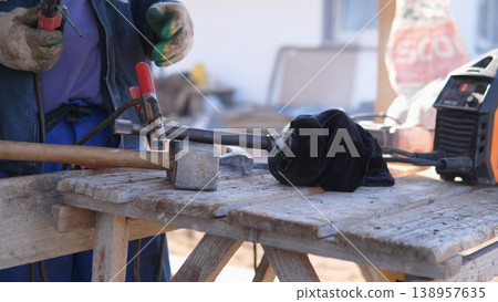 Skilled Fabricator Using Angle Grinder To Shape Metal, Sparks Arcing From Rotating Disc, Hands Steady On Bench, Safety Gear Visible, Industrial Outdoor Worksite Vibe With Concentrated Skilled Fabricator Using Angle Grinder To Shape Metal, Sparks Arcing From Rotating Disc, Hands Steady On Bench, Safety Gear Visible, Industrial Outdoor Worksite Vibe With Concentrated 138957635