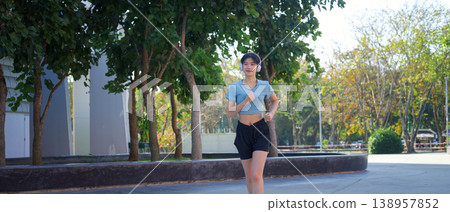 woman running in the park woman running in the park 138957852