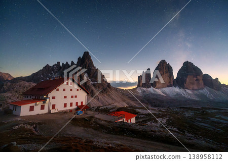 Scenic view of Milky Way over Tre Cime di Lavaredo mountain and Rifugio Locatelli at night in Dolomites, Italy 138958112