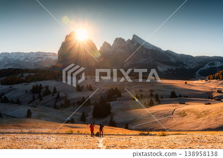 Autumn morning at Seiser Alm with sunrise over Dolomites mountain and rolling hill in Italy Autumn morning at Seiser Alm with sunrise over Dolomites mountain and rolling hill in Italy 138958138