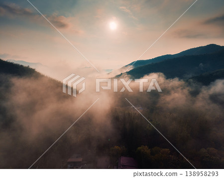 Sunrise over Khao Krajom mountain with foggy in tropical rainforest at Suan Phueng, Ratchaburi Sunrise over Khao Krajom mountain with foggy in tropical rainforest at Suan Phueng, Ratchaburi 138958293