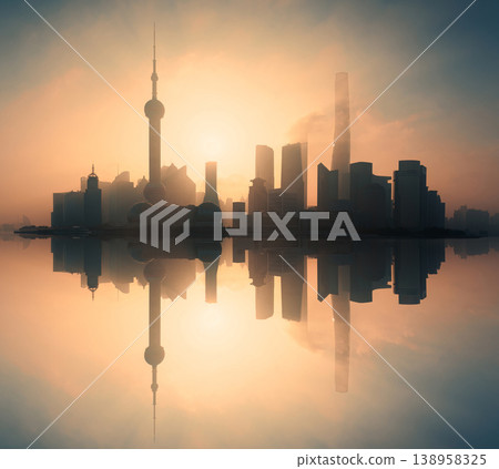 Foggy sunrise over Shanghai skyline with Oriental Pearl Tower and financial skyscraper in Pudong district Foggy sunrise over Shanghai skyline with Oriental Pearl Tower and financial skyscraper in Pudong district 138958325
