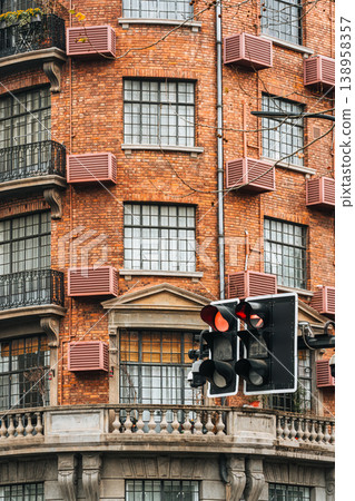 Historic Wukang Mansion brick facade and traffic light in Shanghai Historic Wukang Mansion brick facade and traffic light in Shanghai 138958357