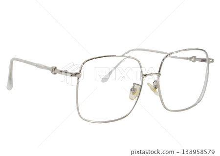 Modern oversized optical glasses with silver metallic rim isolated. Modern oversized optical glasses with silver metallic rim isolated. 138958579