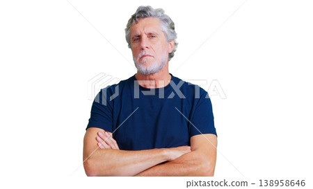 Mature man with serious expression crossing arms Mature man with serious expression crossing arms 138958646