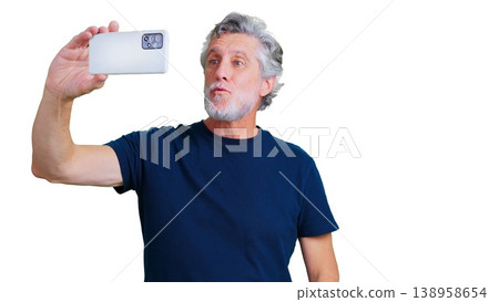 Mature man holding smartphone taking selfie with transparent background Mature man holding smartphone taking selfie with transparent background 138958654