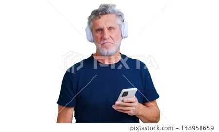 Senior man listening bad music with headphones and smartphone 138958659
