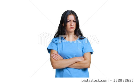 Frustrated young woman crossing arms looking annoyed Frustrated young woman crossing arms looking annoyed 138958685
