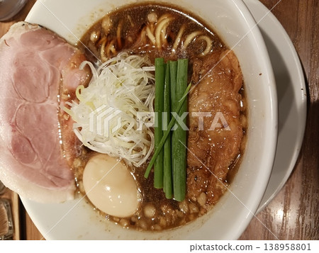 Soy sauce ramen, overhead shot, topped with char siu pork and boiled egg. 138958801