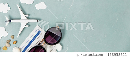 Travel Concept Flat Lay with Airplane, Sunglasses, and Boarding Pass Travel Concept Flat Lay with Airplane, Sunglasses, and Boarding Pass 138958821