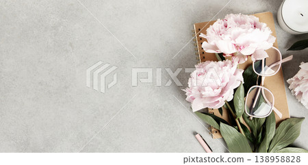 Flat Lay with Peonies, Notebook, and Eyeglasses on Gray Surface Flat Lay with Peonies, Notebook, and Eyeglasses on Gray Surface 138958828