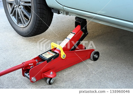 Jacking up the vehicle for tire replacement 138960046