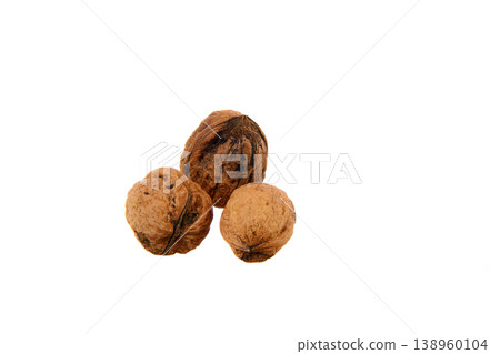 Three Whole Walnuts in Shell on White Background Close-Up Showing Natural Texture and Food Concept Three Whole Walnuts in Shell on White Background Close-Up Showing Natural Texture and Food Concept 138960104