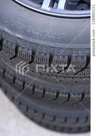 Studded tires stored in the garage 138960151