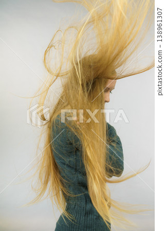 Sad girl with blowing hair Sad girl with blowing hair 138961307