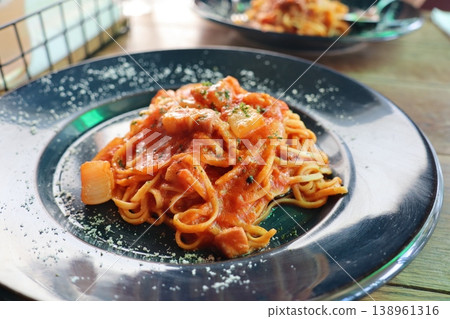 A mouthwatering dish of pasta coated in a rich tomato sauce. A mouthwatering dish of pasta coated in a rich tomato sauce. 138961316