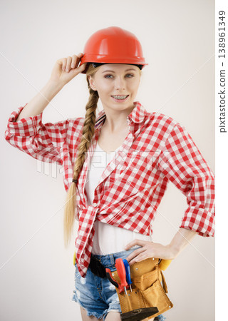 Girl using some power tools for work at home 138961349