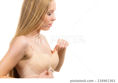 Woman wearing too big bra 138961363