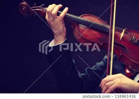 Man man dressed elegantly playing violin Man man dressed elegantly playing violin 138961416