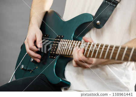 Close up of man playing on electric guitar Close up of man playing on electric guitar 138961441