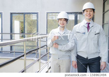 Portrait of a young man and woman in work clothes Portrait of a young man and woman in work clothes 138961494
