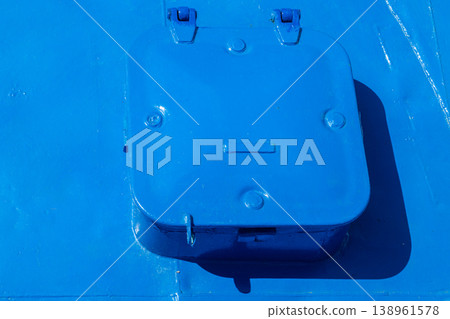 Blue metal raised coaming hatch with hinges and latches outdoors Blue metal raised coaming hatch with hinges and latches outdoors 138961578