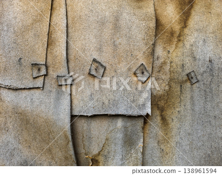 Close-up of textured layered fiberboard wall with visible overlaps Close-up of textured layered fiberboard wall with visible overlaps 138961594