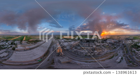 Aerial 360 equirectangular panorama of Industrial cement plant with smokestacks at sunset Aerial 360 equirectangular panorama of Industrial cement plant with smokestacks at sunset 138961613