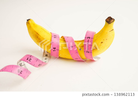 Banana with measuring tape, penis health. Banana with measuring tape, penis health. 138962113